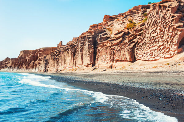 Beautiful Vlychada beach with volcanic pumice cliffs and turquoise water on Santorini island, Greece.